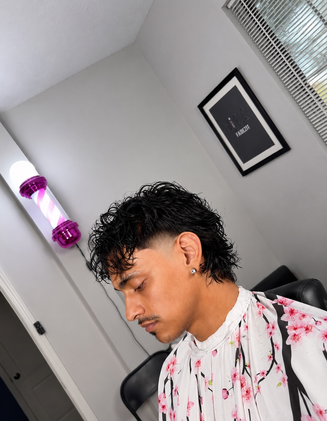 Curly textured cut with low taper fade